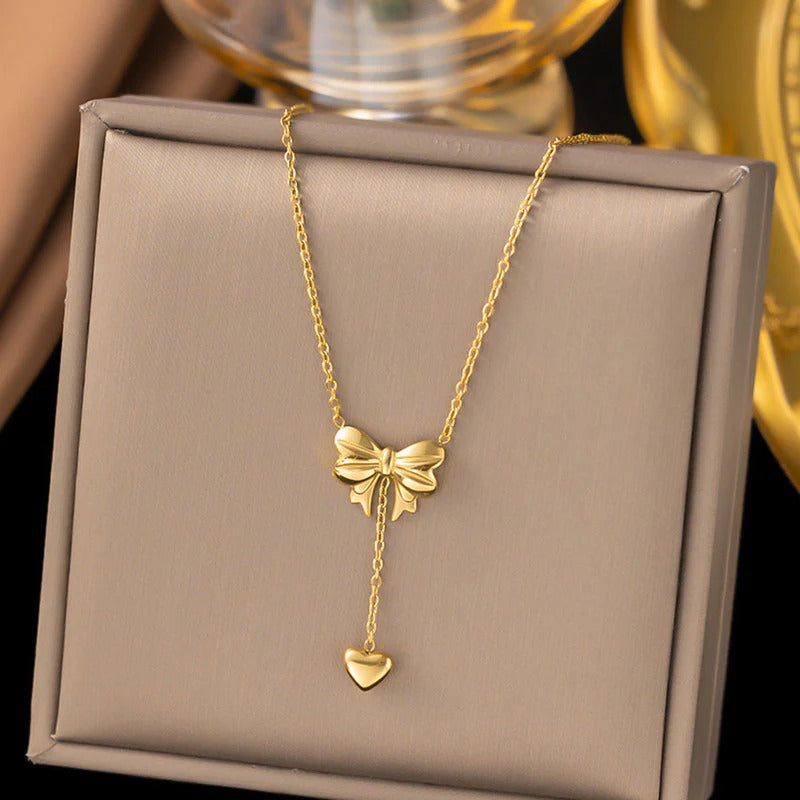 Gold Plated Stainless Steel Anti Tarnish Heart Themed Bow inspired Pendant Necklace