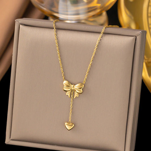 Gold Plated Stainless Steel Anti Tarnish Heart Themed Bow inspired Pendant Necklace