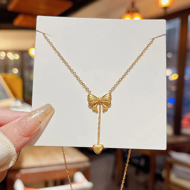 Gold Plated Stainless Steel Anti Tarnish Heart Themed Bow inspired Pendant Necklace