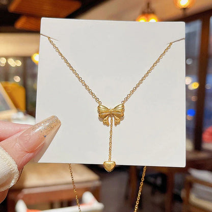 Gold Plated Stainless Steel Anti Tarnish Heart Themed Bow inspired Pendant Necklace