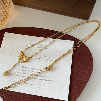 Gold Plated Stainless Steel Anti Tarnish Heart Themed Bow inspired Pendant Necklace